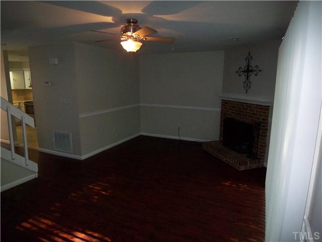 7300 Sandy Creek Drive Raleigh, NC 27615 - Photo 12 of 25 wooden floor in an empty room with a window