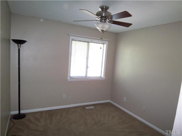 7300 Sandy Creek Drive Raleigh, NC 27615 - Photo 21 of 25 a view of an empty room with a window