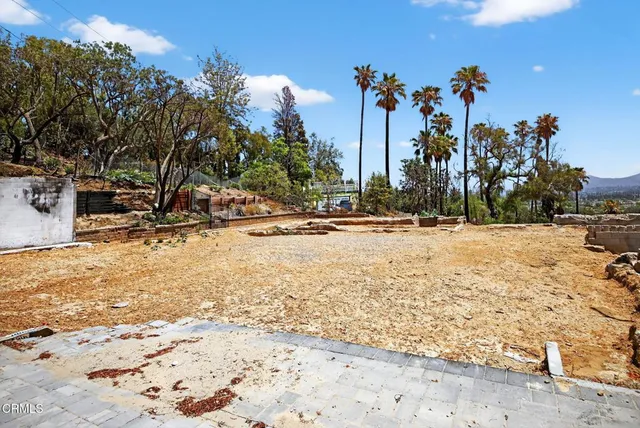 a view of a ocean with a mountain in the background