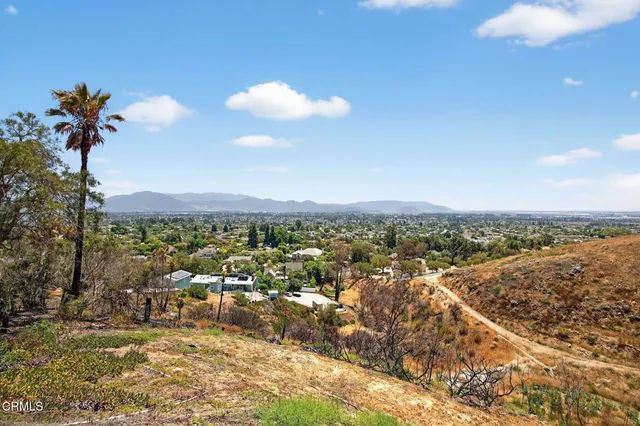 a view of a backyard of the house