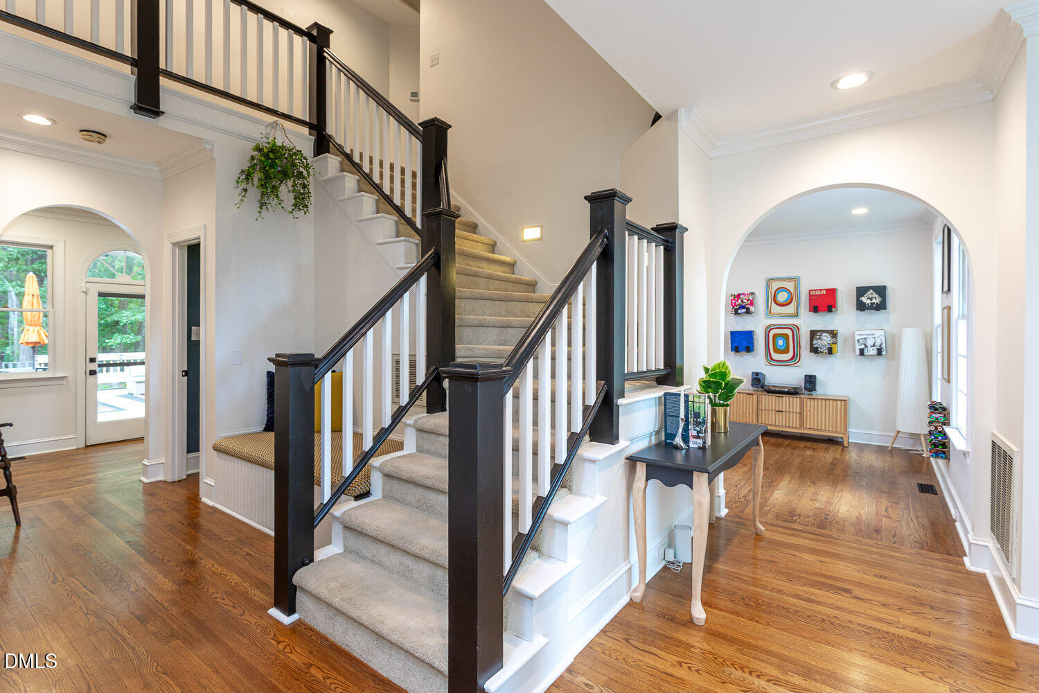 8509 Towneley Place Raleigh, NC 27615 - Photo 5 of 36 a view of entryway livingroom and hall with wooden floor