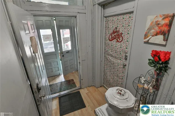 a view of walk in closet with clothes