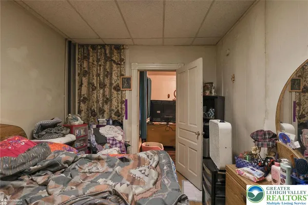 a bathroom with a sink a toilet and shower curtain