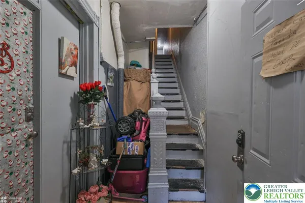 a room with furniture and flat screen tv