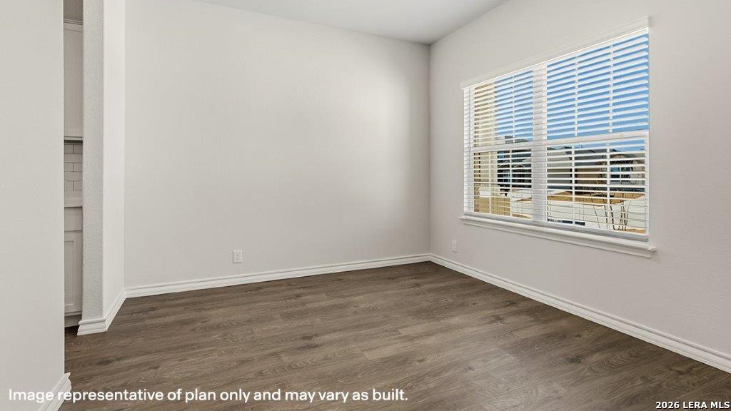 523 Avalon Banks Cibolo, TX 78108 - Photo 16 of 79 a view of an empty room with wooden floor and a window