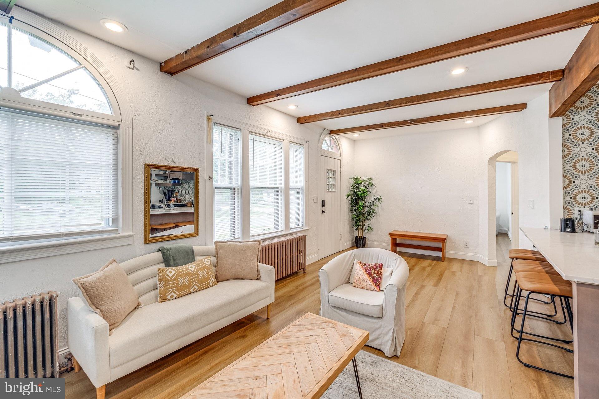 4209 Queensbury Road Hyattsville, MD 20781 - Photo 3 of 12 a living room with furniture and a large window