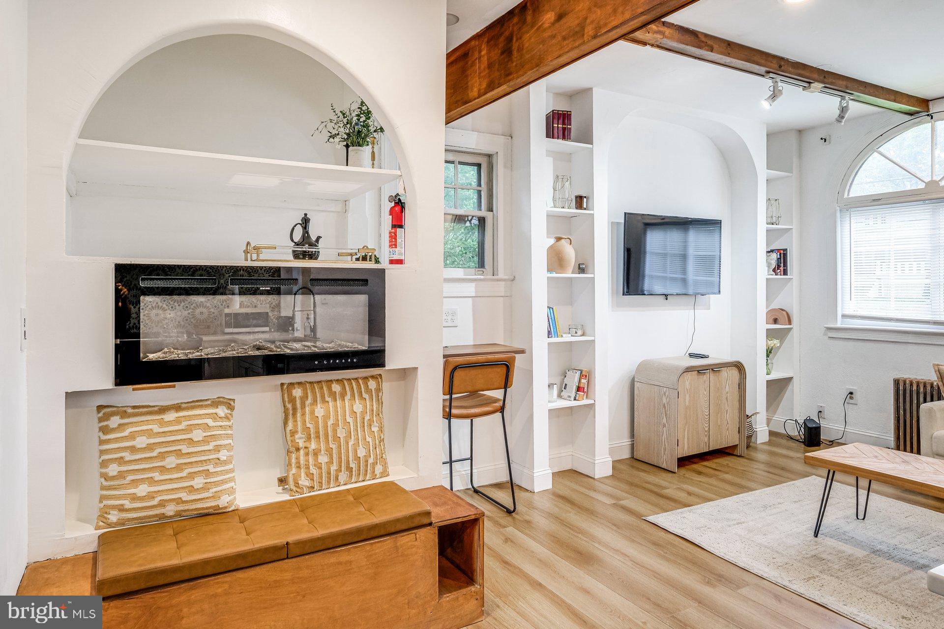 4209 Queensbury Road Hyattsville, MD 20781 - Photo 4 of 12 a living room with furniture and a flat screen tv