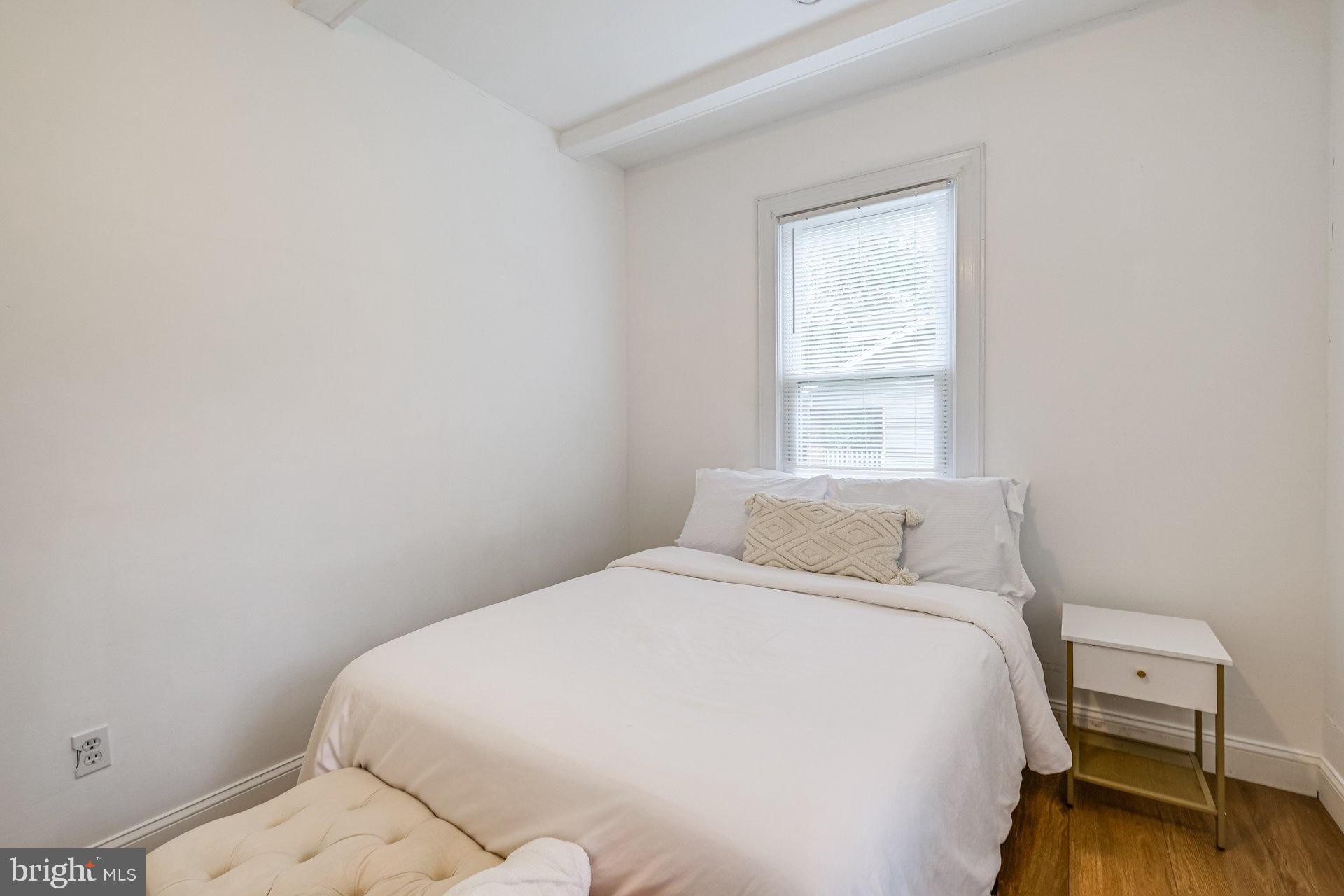 4209 Queensbury Road Hyattsville, MD 20781 - Photo 7 of 12 a bedroom with a bed and a window