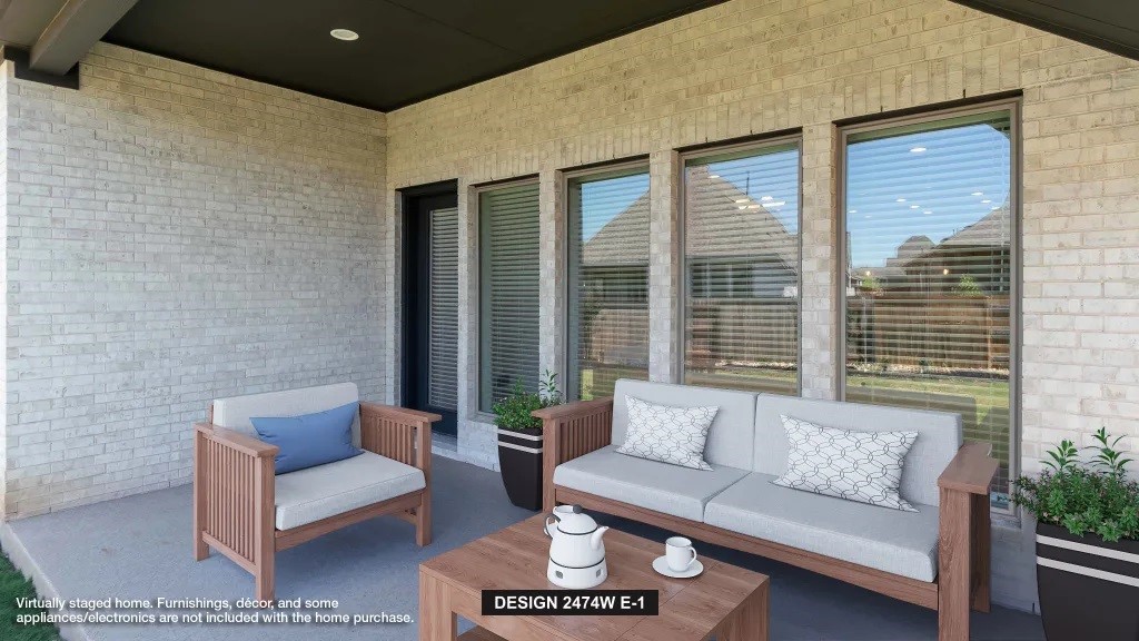 18403 Shaded Sylvan Path Manvel, TX 77578 - Photo 5 of 7 a view of a patio with couches and a potted plant on a table