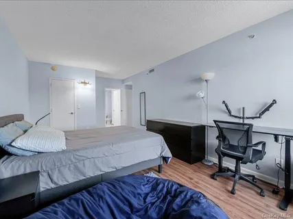 a bedroom with a bed and a table