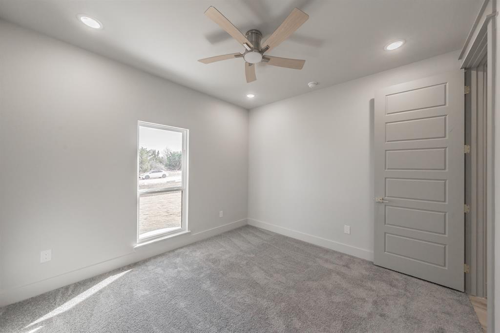 7805 Kenleigh Lane Rio Vista, TX 76093 - Photo 20 of 40 Spare room with light carpet, recessed lighting, and ceiling fan