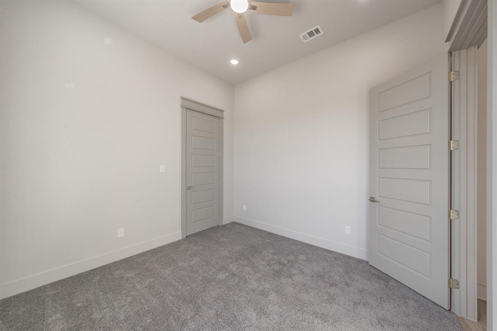 7805 Kenleigh Lane Rio Vista, TX 76093 - Photo 22 of 40 Carpeted spare room featuring a ceiling fan and recessed lighting