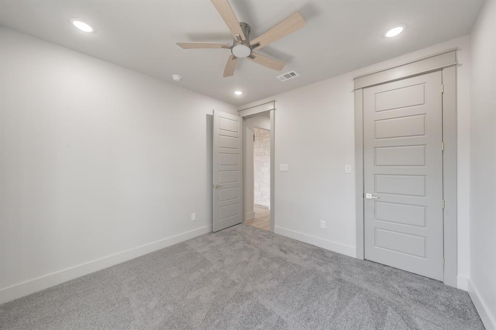 7805 Kenleigh Lane Rio Vista, TX 76093 - Photo 23 of 40 Unfurnished bedroom featuring carpet, a ceiling fan, and recessed lighting
