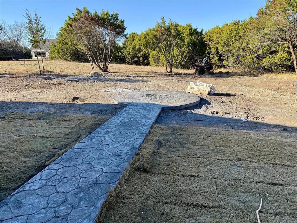 7805 Kenleigh Lane Rio Vista, TX 76093 - Photo 24 of 37 a view of a yard with trees