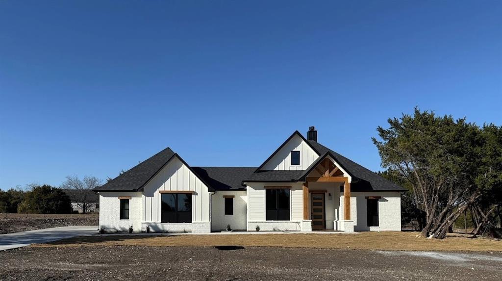 7805 Kenleigh Lane Rio Vista, TX 76093 - Photo 3 of 37 a front view of a house with yard and road