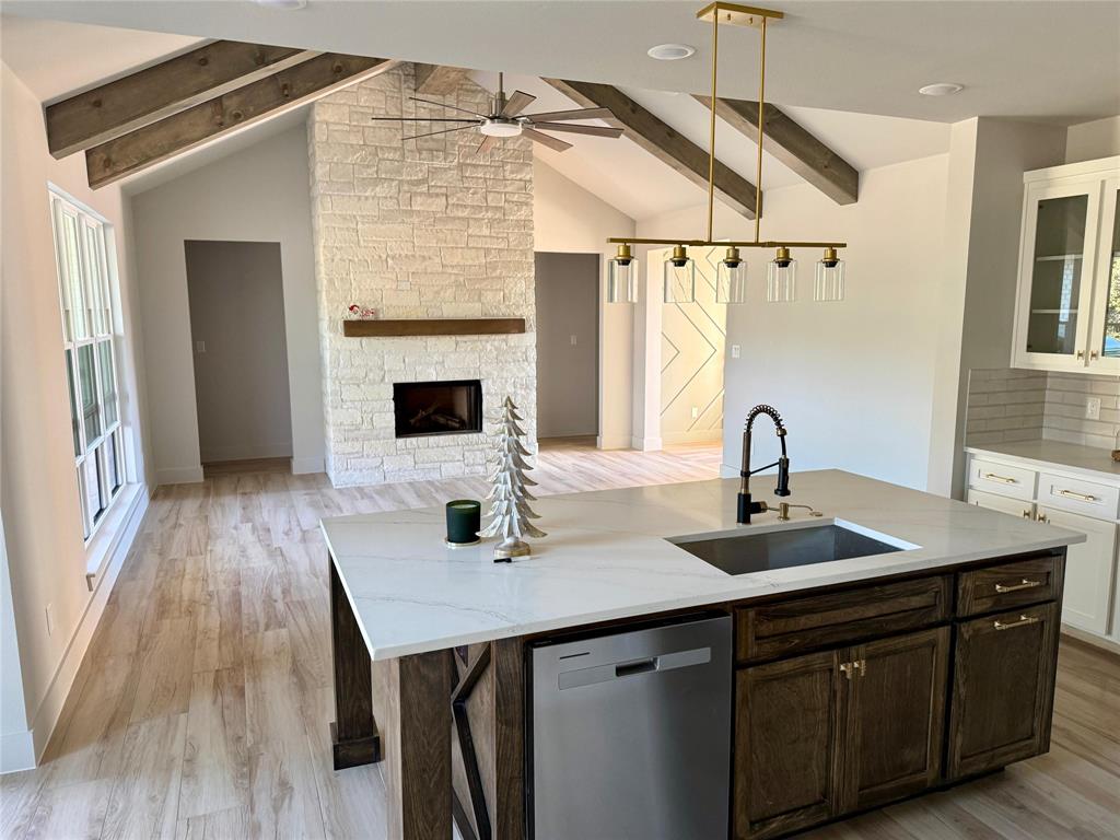 7805 Kenleigh Lane Rio Vista, TX 76093 - Photo 37 of 37 a kitchen with a sink cabinets and wooden floor
