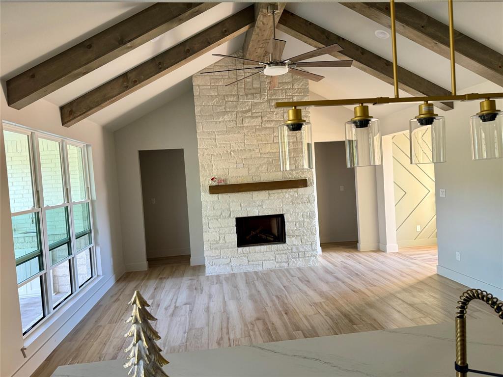 7805 Kenleigh Lane Rio Vista, TX 76093 - Photo 34 of 37 a view of a livingroom with wooden floor and a fireplace