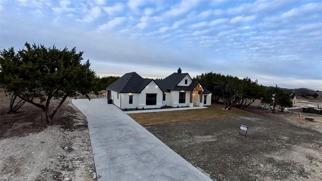 7805 Kenleigh Lane Rio Vista, TX 76093 - Photo 6 of 40 View of front of house with a chimney and a porch