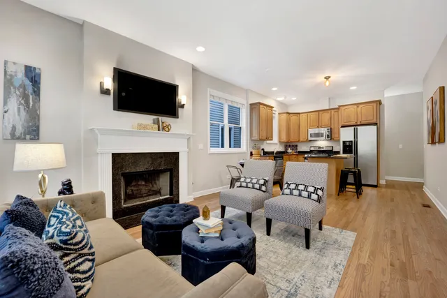 a living room with furniture fireplace and a flat screen tv