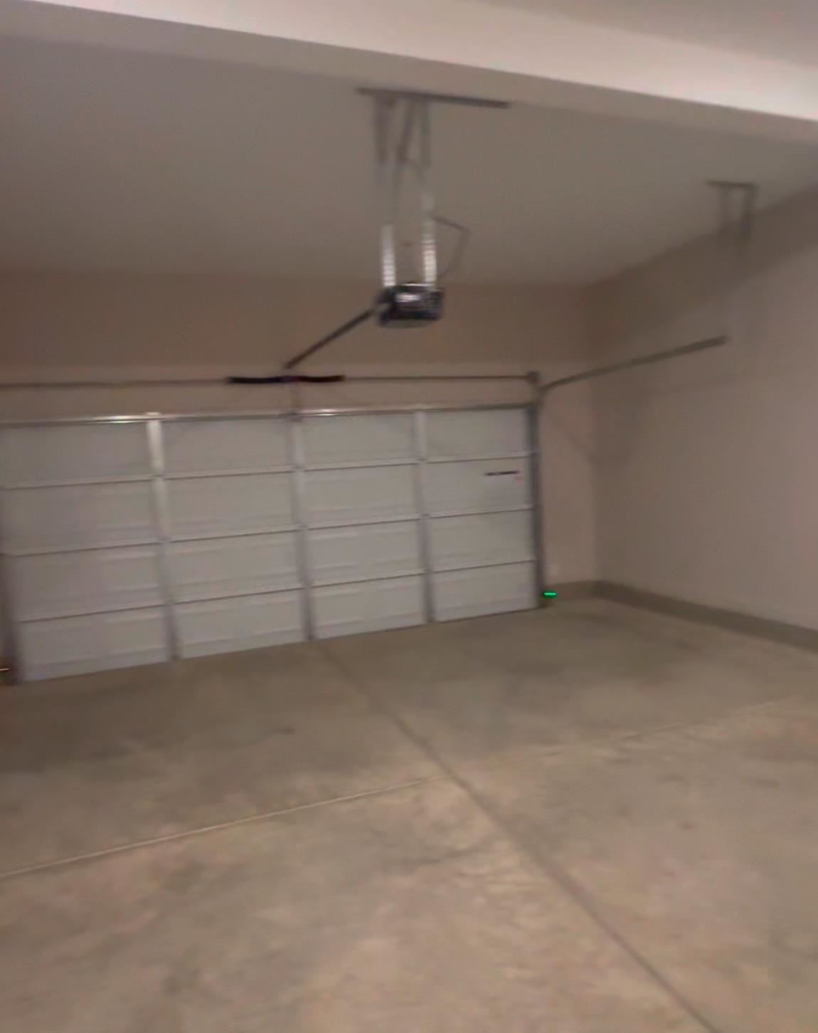 5714 Gerber Road Arlington, TN 38002 - Photo 15 of 19 Garage featuring a garage door opener