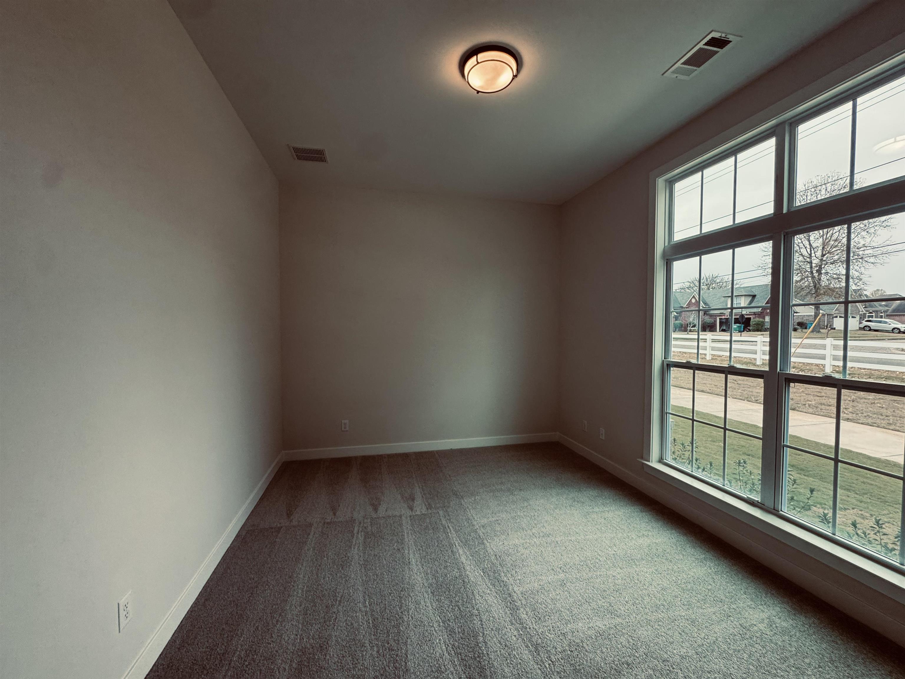 Empty room featuring carpet floors