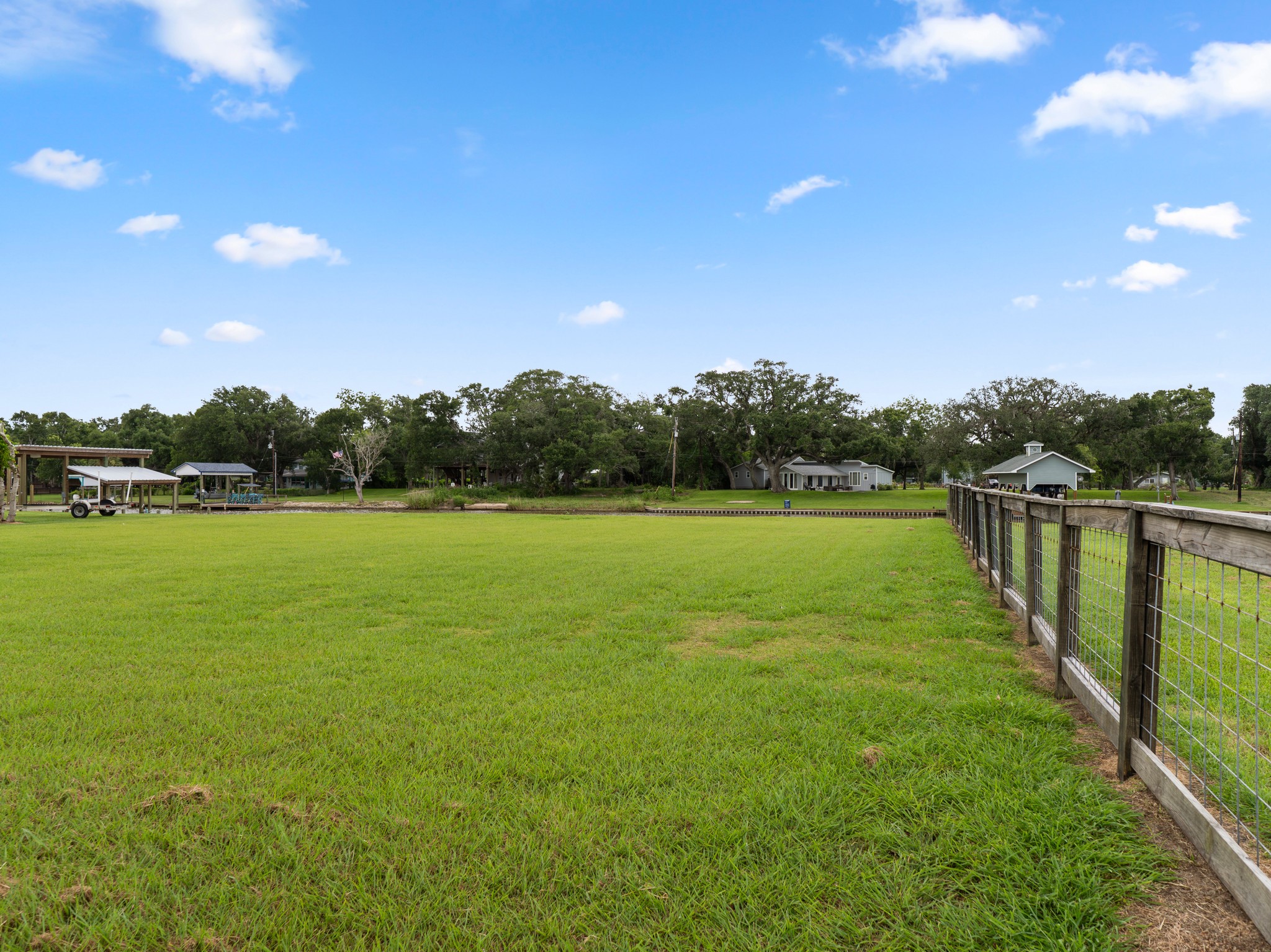 7 County Road 291 Sargent, TX 77414 - Photo 13 of 19 a view of a lake with a big yard