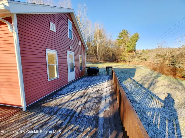 a balcony view with a seating space