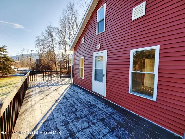 a view of a brick building next to a yard
