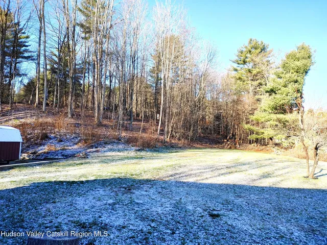 a view of a swimming pool with an outdoor space and seating area