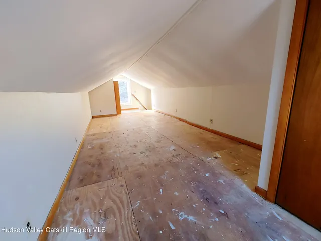 a view of walk in closet with clothes