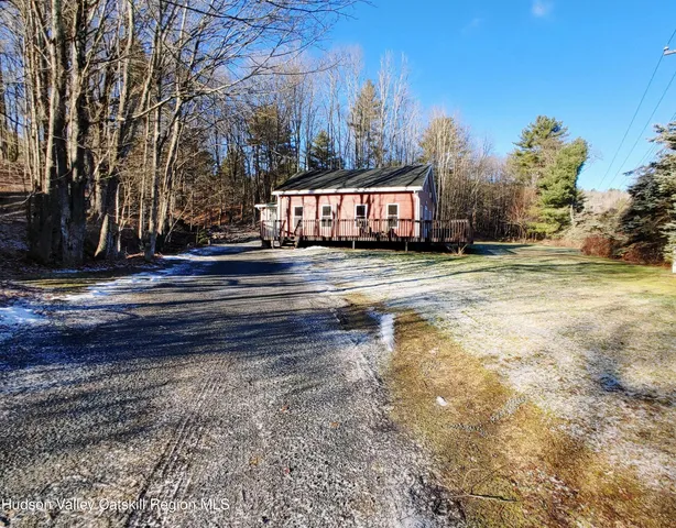 a view of a yard with large trees