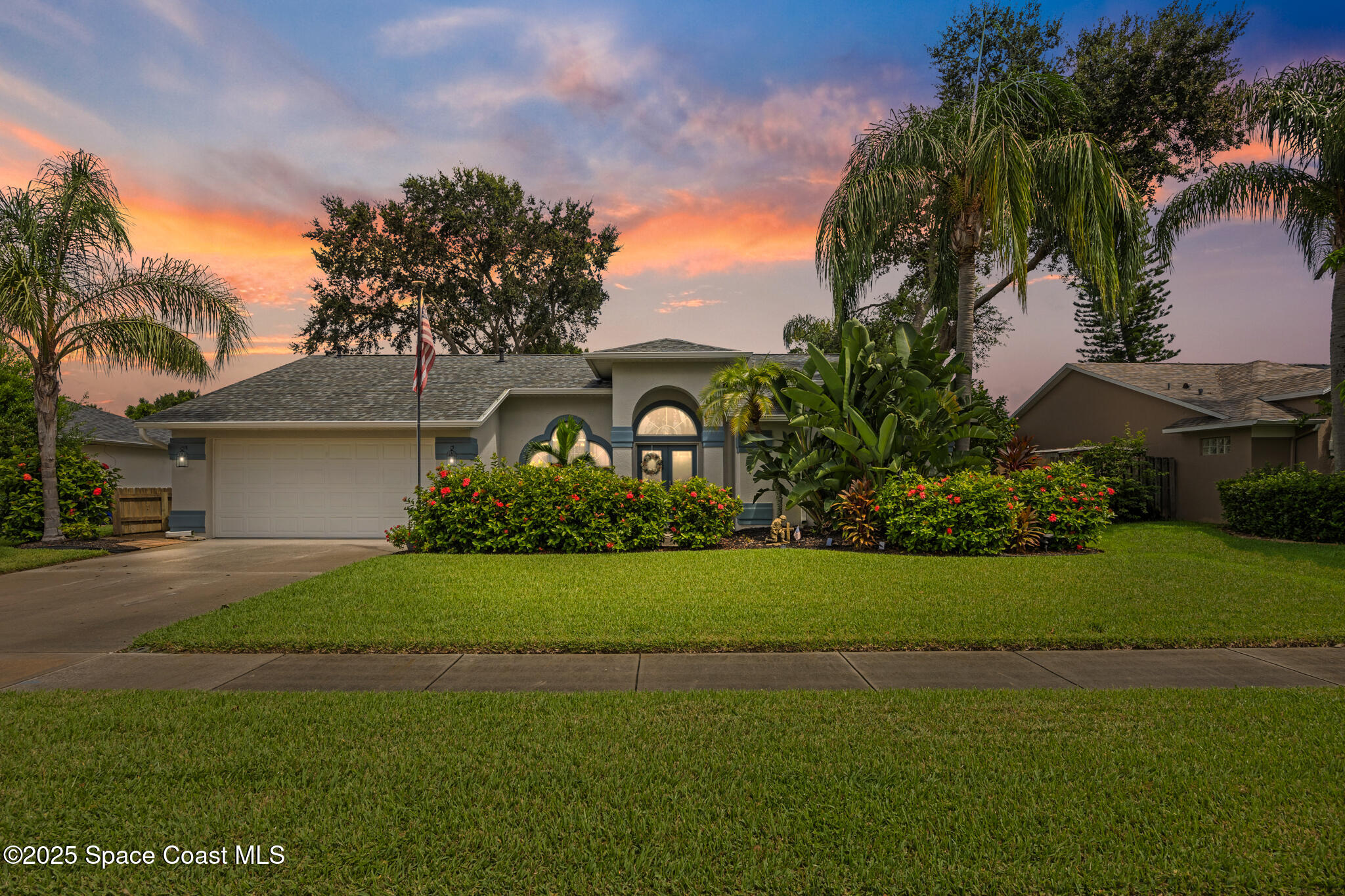 1252 Winding Meadows Road Rockledge, FL 32955 - Photo 1 of 32 a front view of a house with a garden and yard