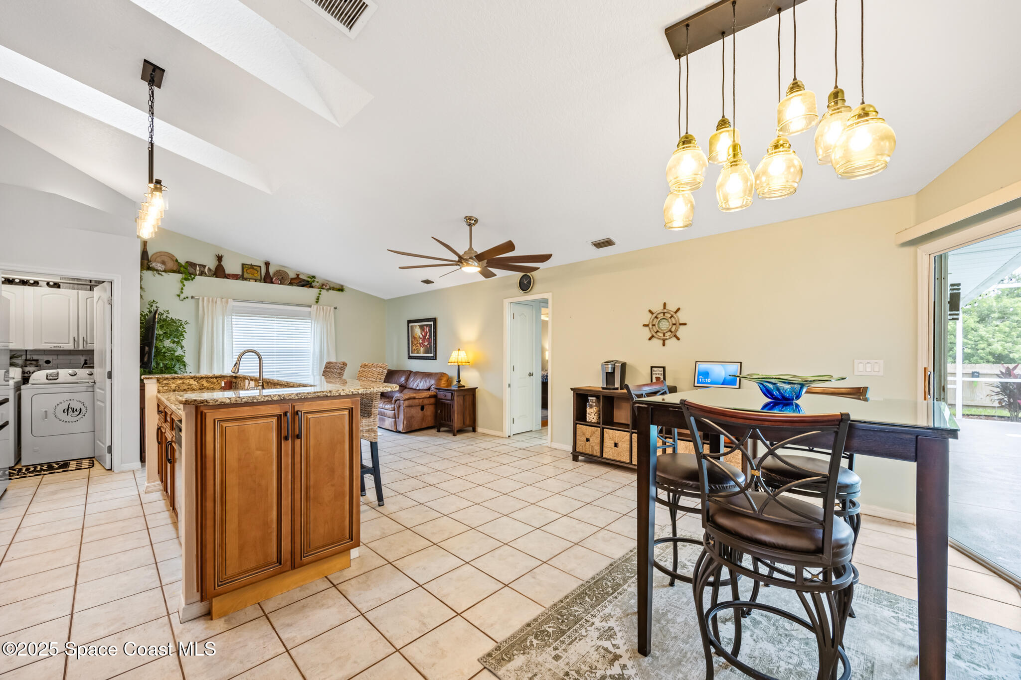 1252 Winding Meadows Road Rockledge, FL 32955 - Photo 12 of 32 a view of a dining room with furniture