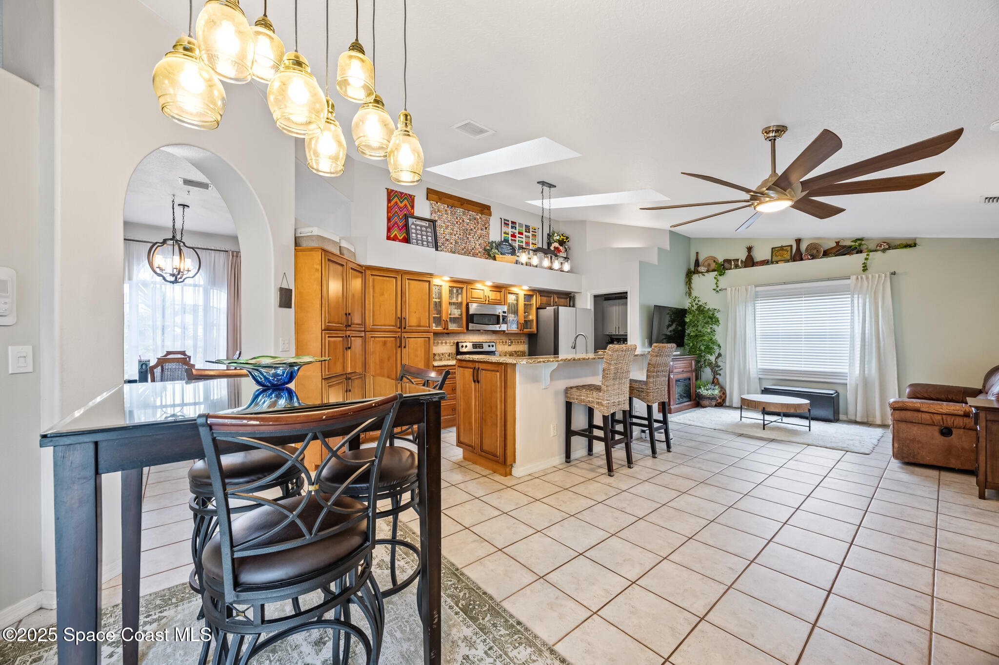 1252 Winding Meadows Road Rockledge, FL 32955 - Photo 15 of 32 a view of a dining room with furniture and chandelier