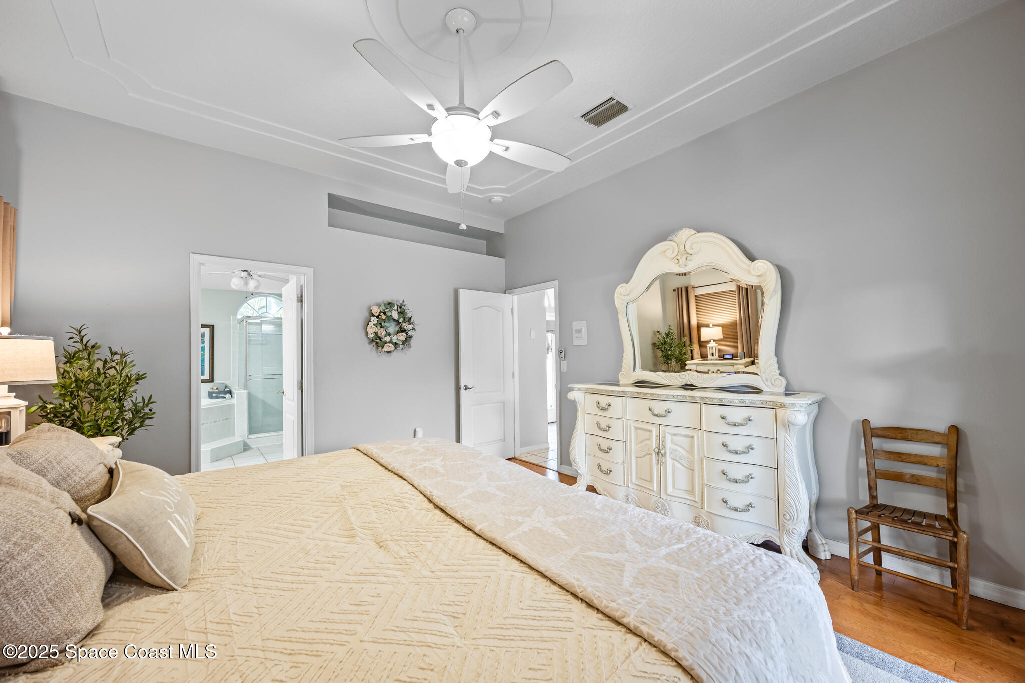 1252 Winding Meadows Road Rockledge, FL 32955 - Photo 20 of 32 a bedroom with a bed and a dresser