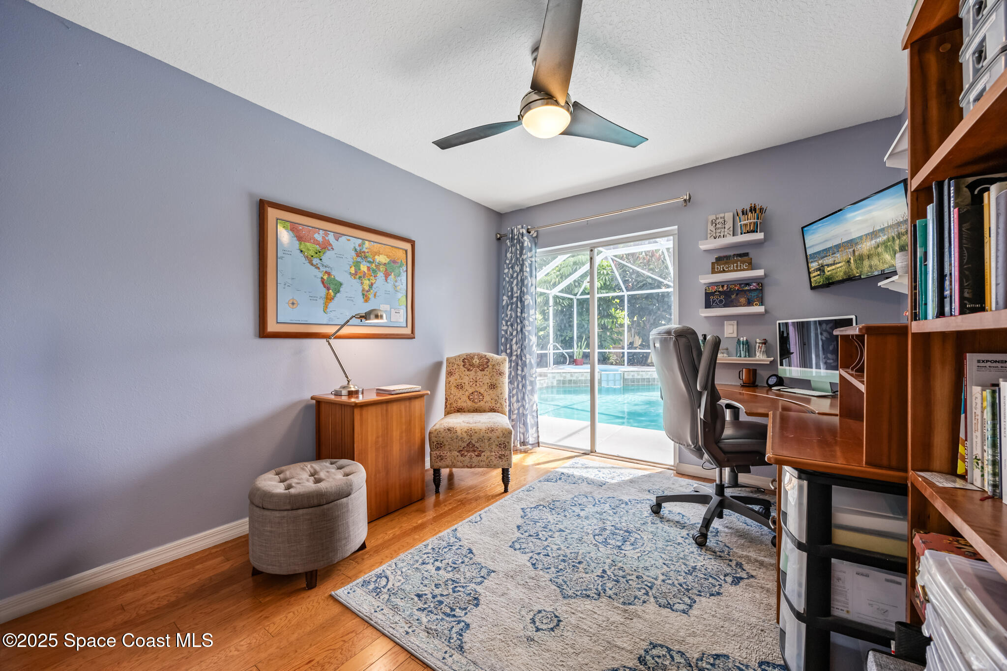 1252 Winding Meadows Road Rockledge, FL 32955 - Photo 26 of 32 a living room with furniture a rug and a window