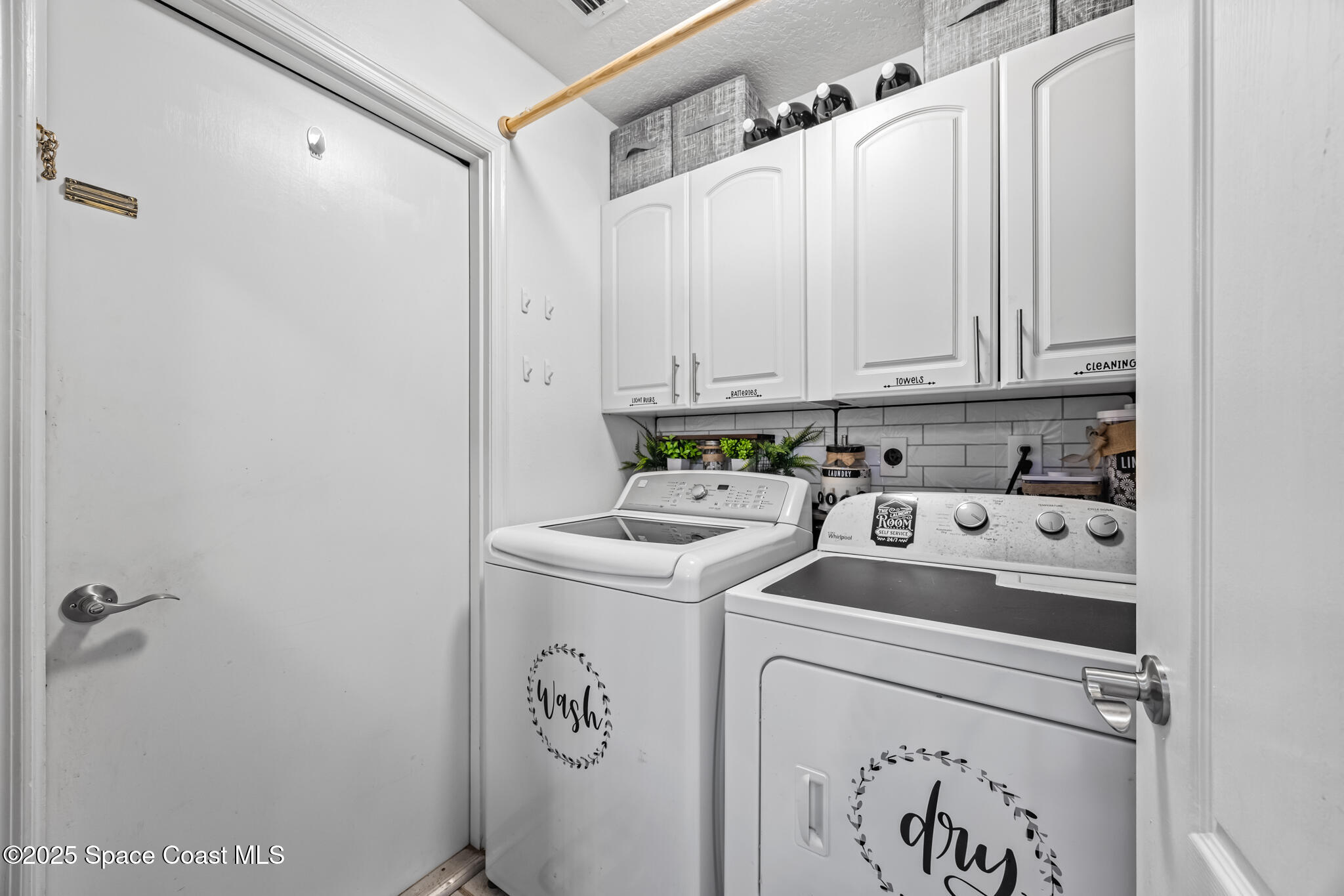 1252 Winding Meadows Road Rockledge, FL 32955 - Photo 27 of 32 a utility room with dryer and washer