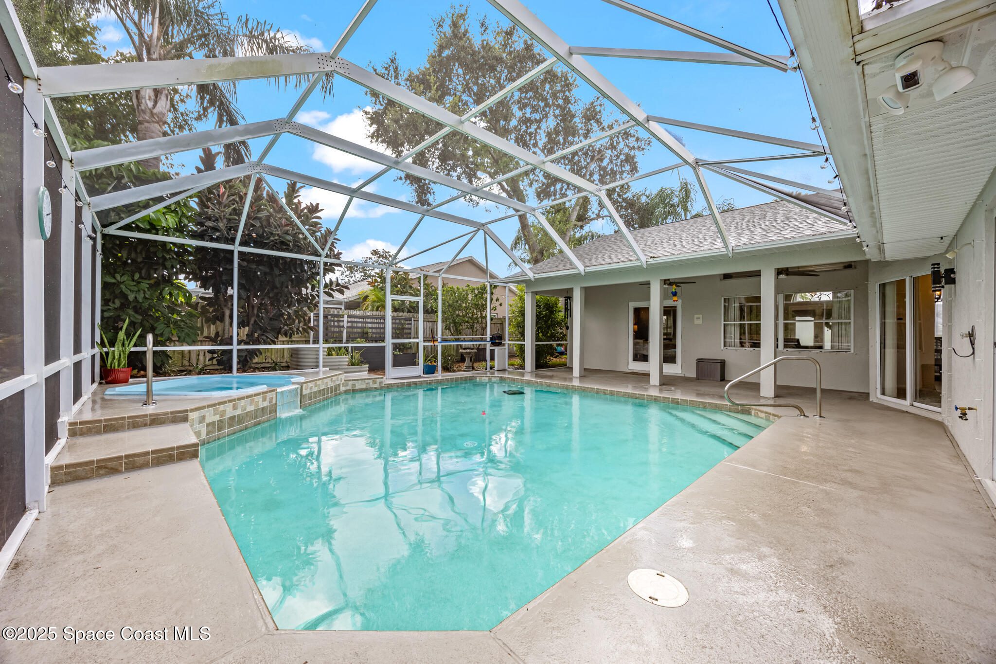 1252 Winding Meadows Road Rockledge, FL 32955 - Photo 31 of 32 a view of a house with backyard porch and sitting area