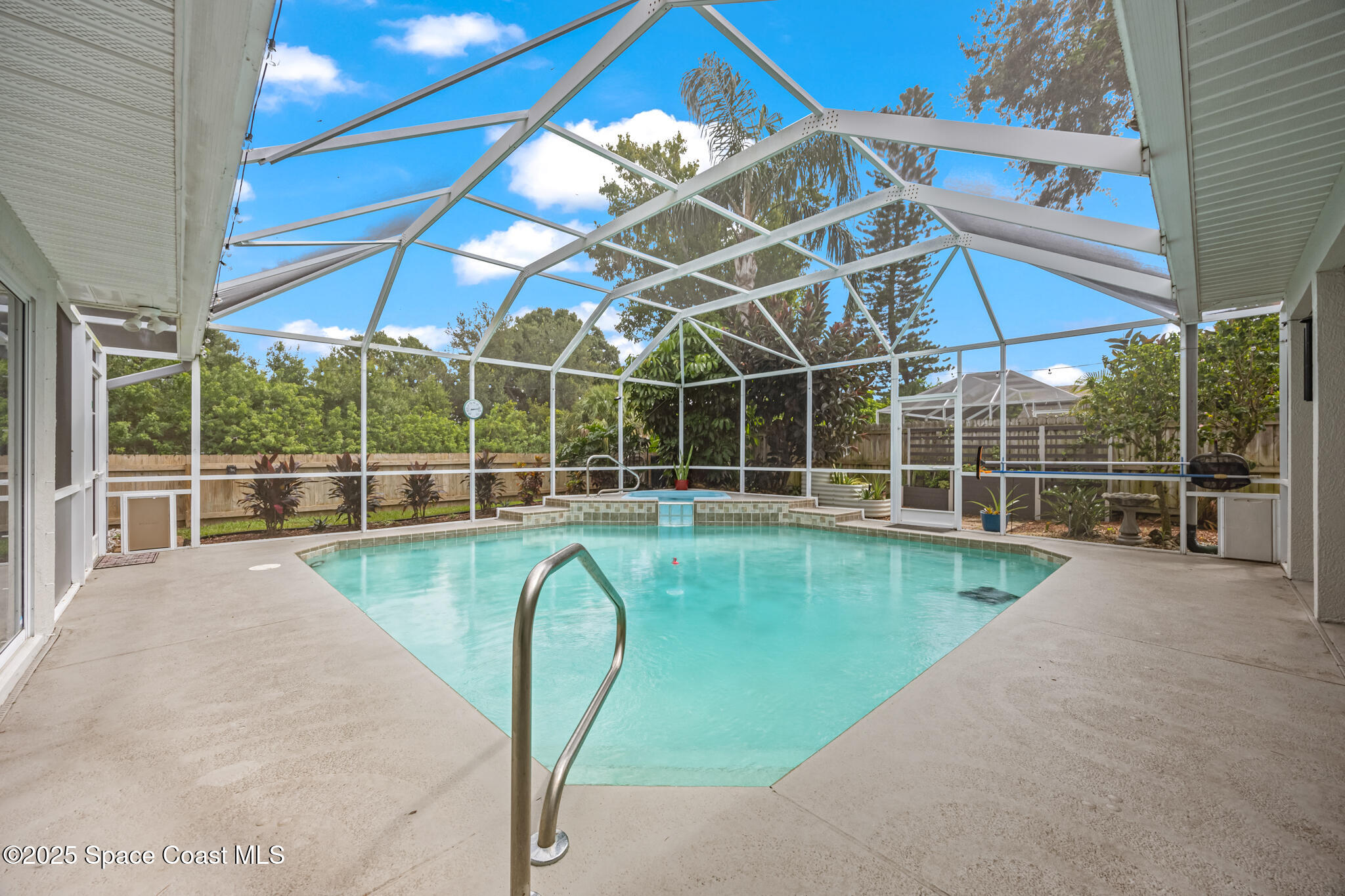 1252 Winding Meadows Road Rockledge, FL 32955 - Photo 32 of 32 a view of a swimming pool with a porch