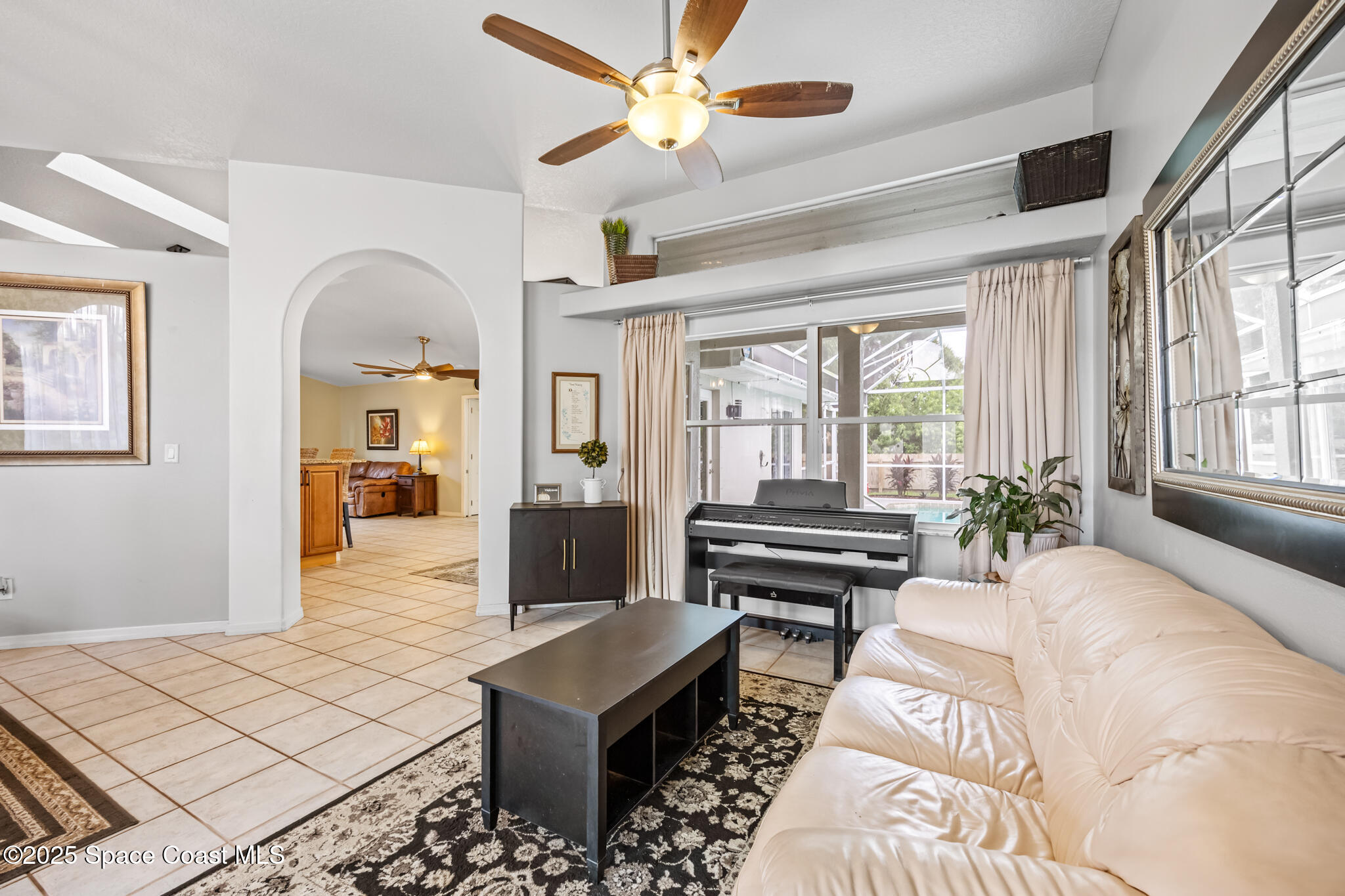 1252 Winding Meadows Road Rockledge, FL 32955 - Photo 6 of 32 a living room with furniture and a window
