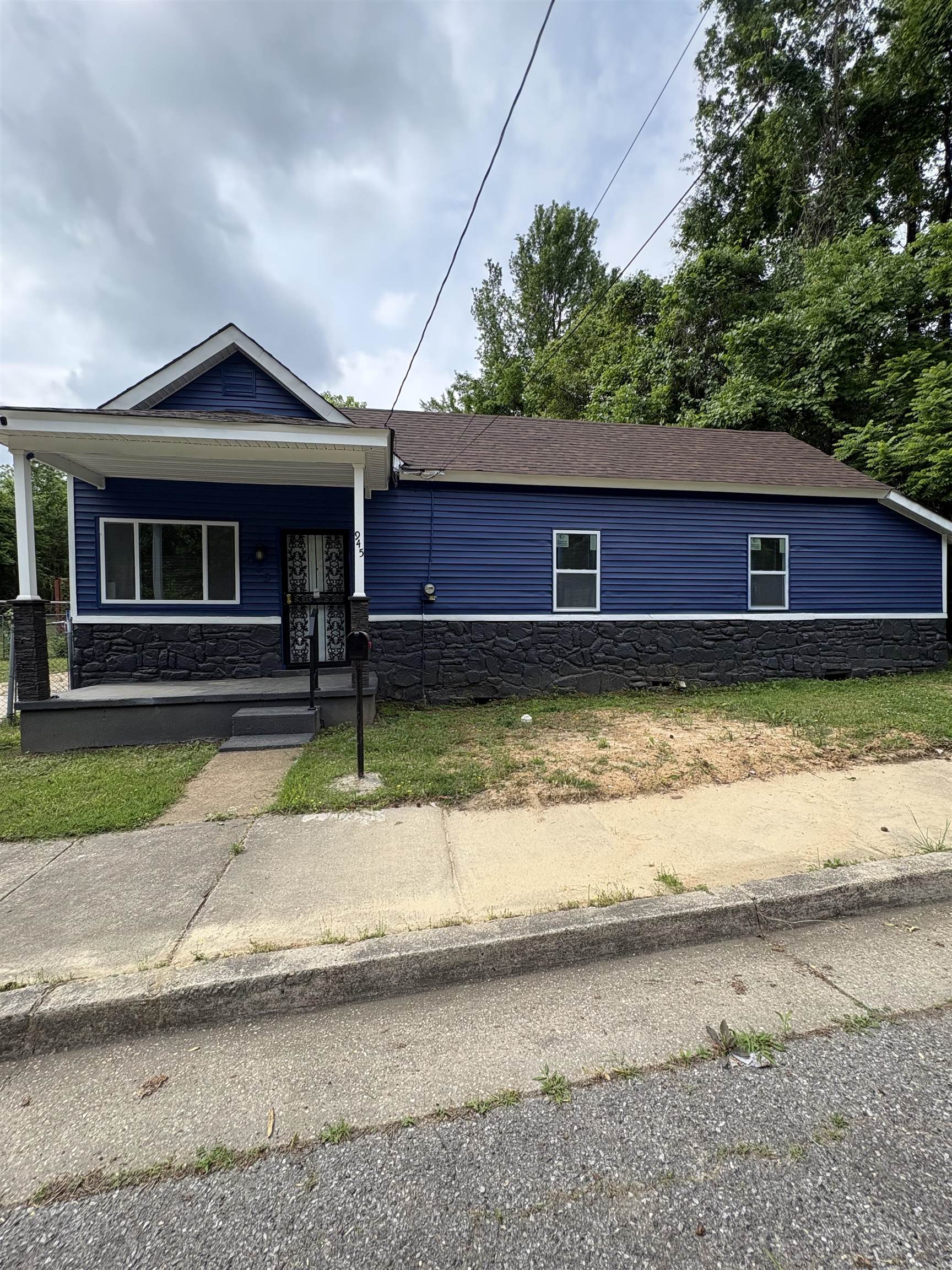 945 Nora Road Memphis, TN 38109 - Photo 1 of 27 a view of a house with a yard