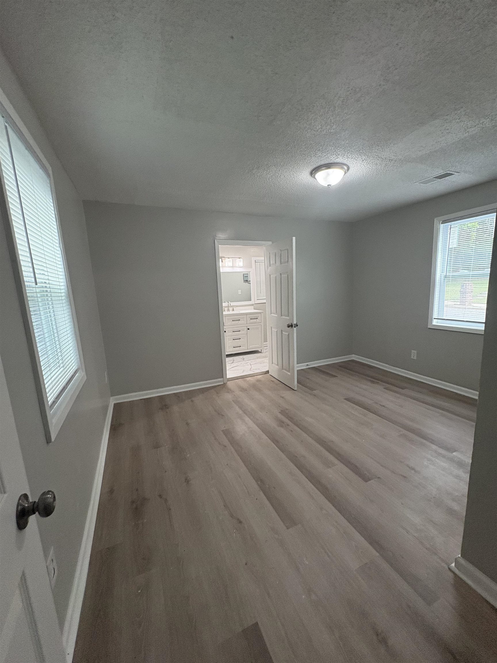 945 Nora Road Memphis, TN 38109 - Photo 15 of 27 a view of empty room with wooden floor and fan