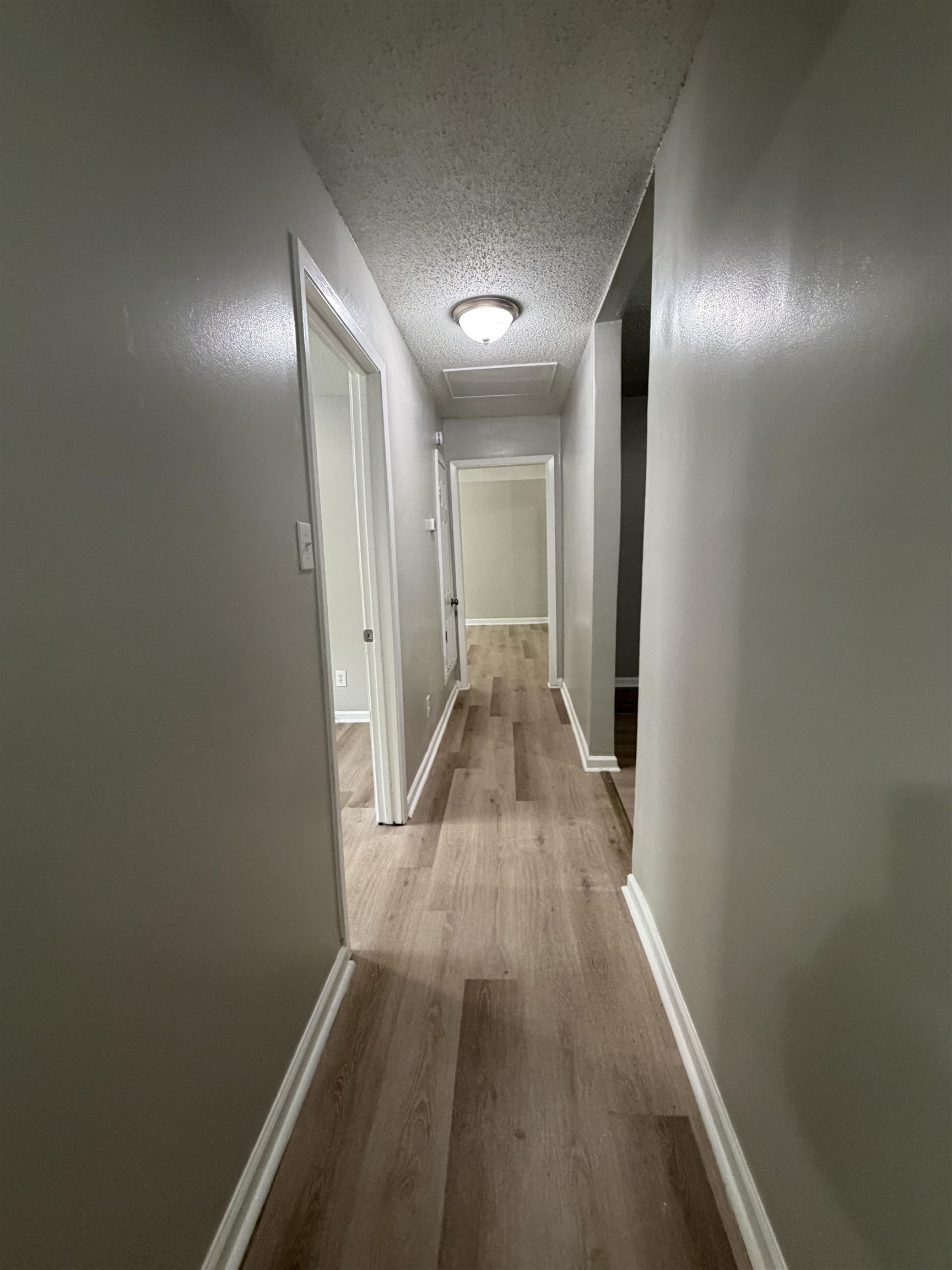 945 Nora Road Memphis, TN 38109 - Photo 2 of 27 a view of hallway with wooden floor