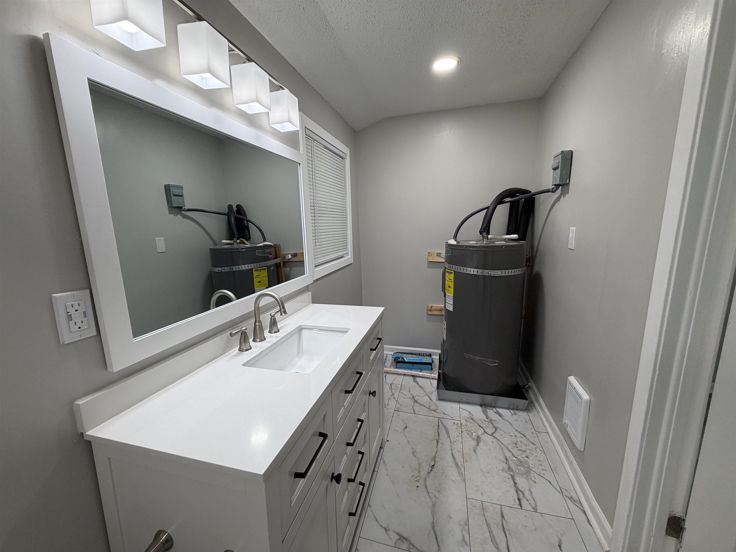 945 Nora Road Memphis, TN 38109 - Photo 3 of 27 a kitchen with a sink and a refrigerator