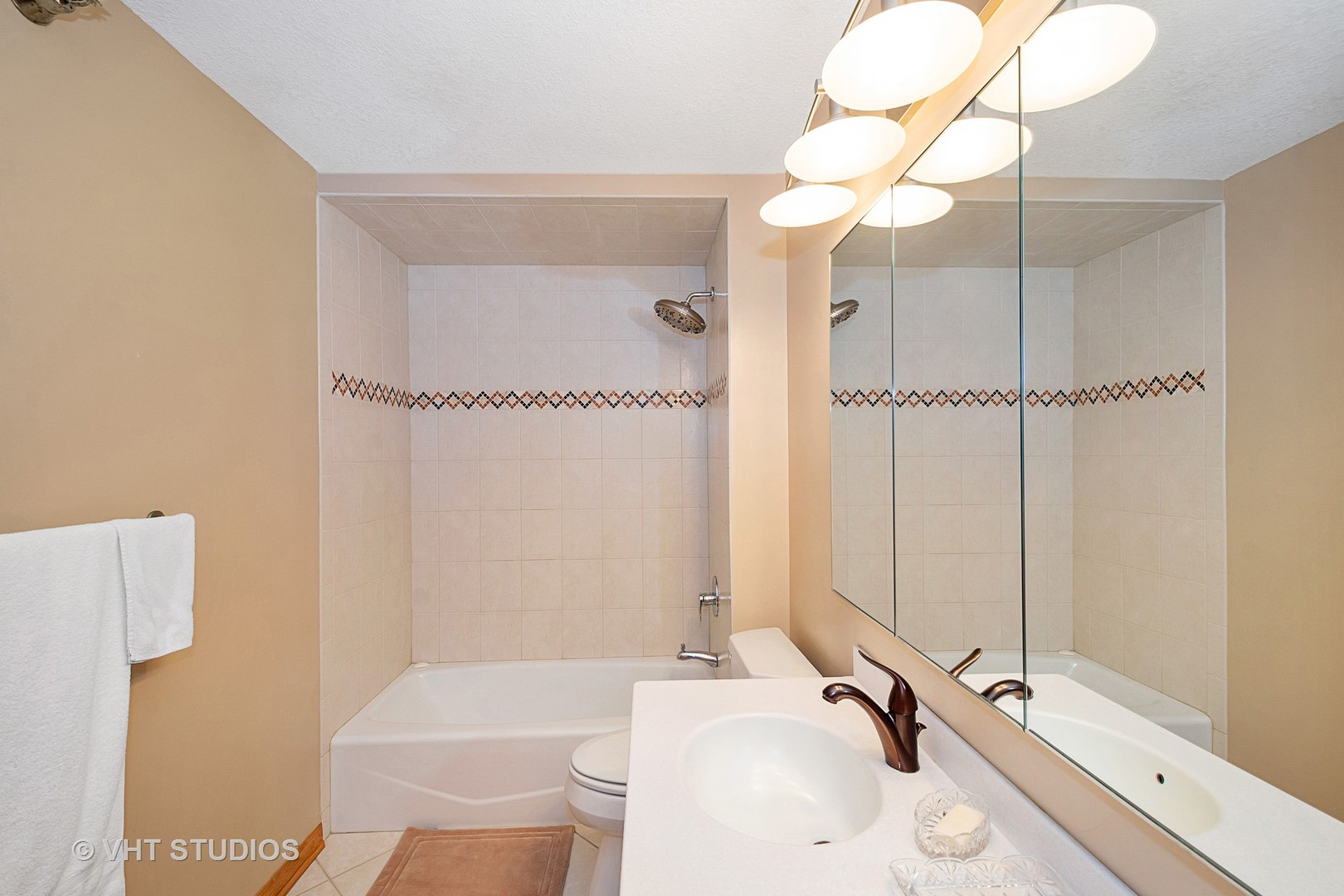 195 North Harbor Drive, Unit 5201 Chicago, IL 60601 - Photo 12 of 16 a bathroom with a sink a toilet and shower