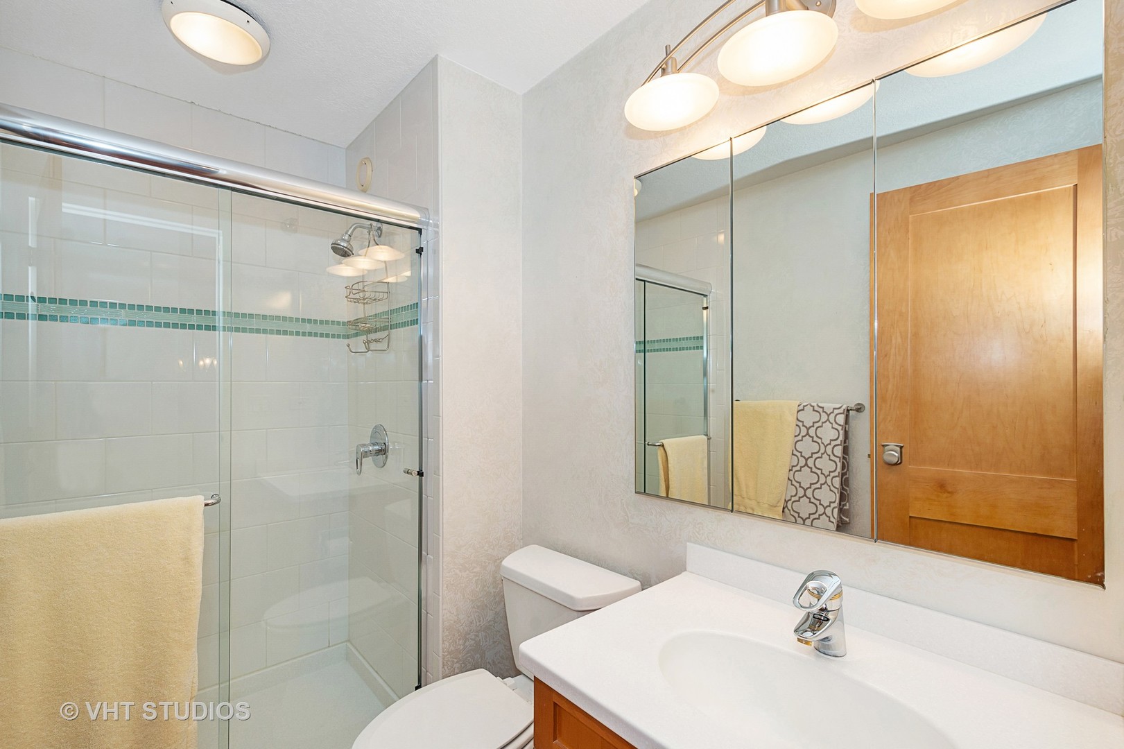 195 North Harbor Drive, Unit 5201 Chicago, IL 60601 - Photo 13 of 16 a bathroom with a sink toilet and shower