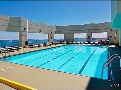 195 North Harbor Drive, Unit 5201 Chicago, IL 60601 - Photo 15 of 16 a view of a kitchen with stainless steel appliances a sink and a stove