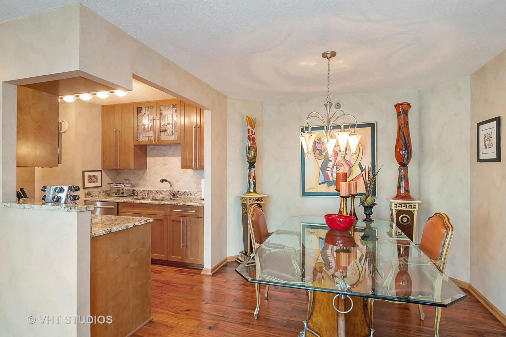 195 North Harbor Drive, Unit 5201 Chicago, IL 60601 - Photo 9 of 16 a very nice looking dining room with furniture and a chandelier