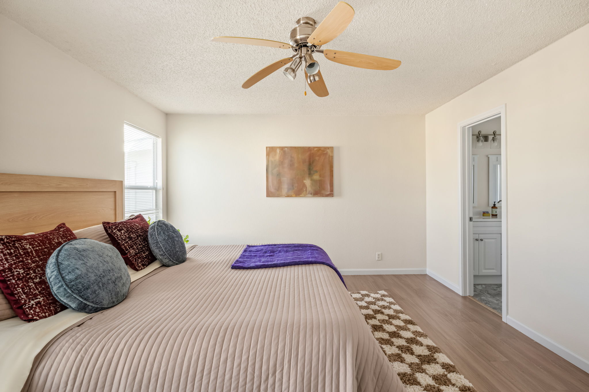 161 Segovia Way Pflugerville, TX 78660 - Photo 18 of 37 a bedroom with a bed and a chandelier