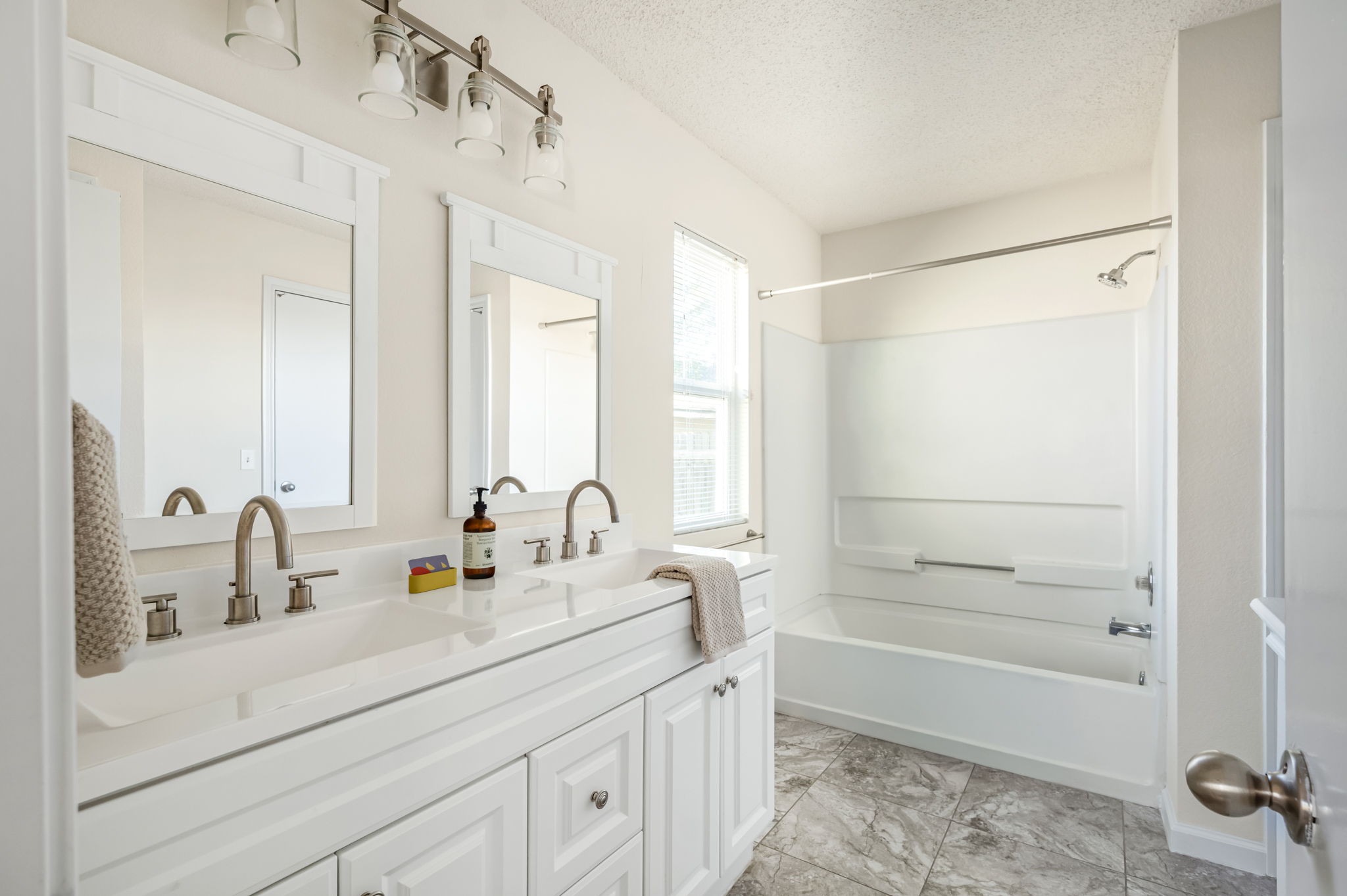 161 Segovia Way Pflugerville, TX 78660 - Photo 19 of 37 a bathroom with a sink a toilet a mirror and shower